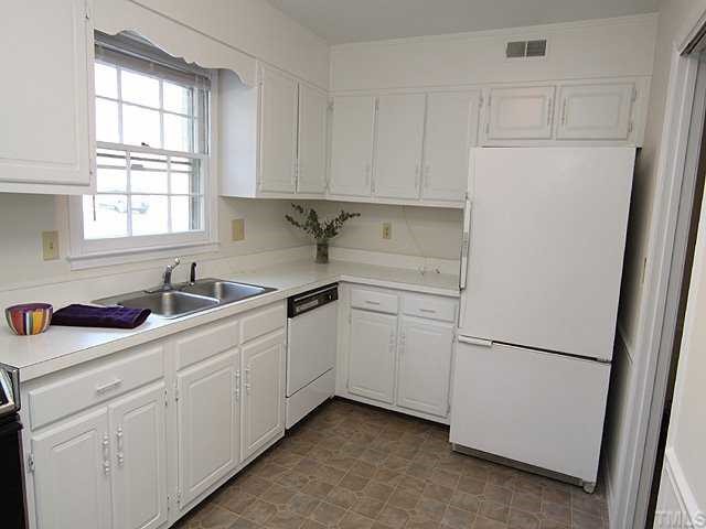 3140 Morningside Drive Raleigh, NC 27607 - Photo 4 of 25 Kitchen and enitre unit recently updated with fresh paint. Large refrigerator conveys!