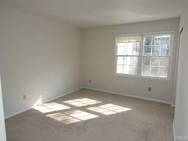 3140 Morningside Drive Raleigh, NC 27607 - Photo 8 of 25 Master bedroom overlooks private patio and wooded area. It also has 2 closets plus a linen closet!