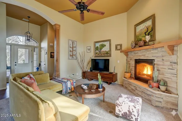 a living room with furniture and a fireplace