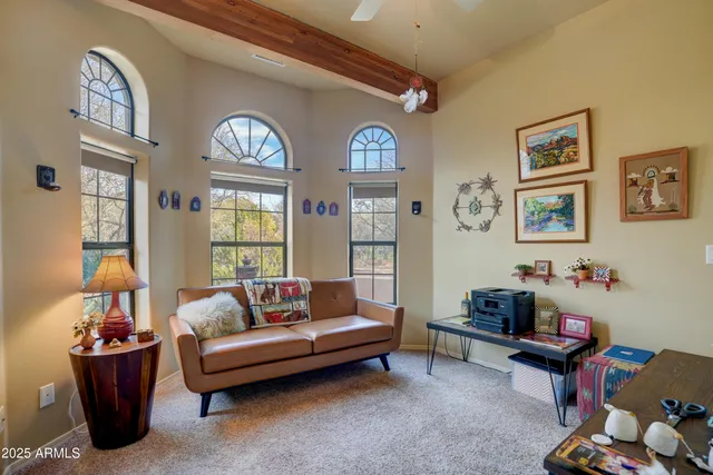 a living room with furniture and a window