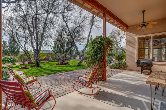 a view of a backyard with sitting area