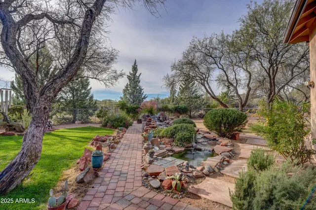 a view of a park with large trees