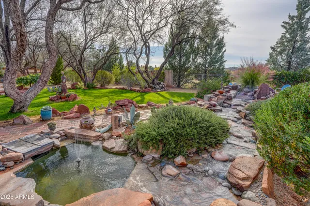 a view of a swimming pool with a yard