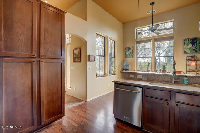 a kitchen with a sink a refrigerator and window