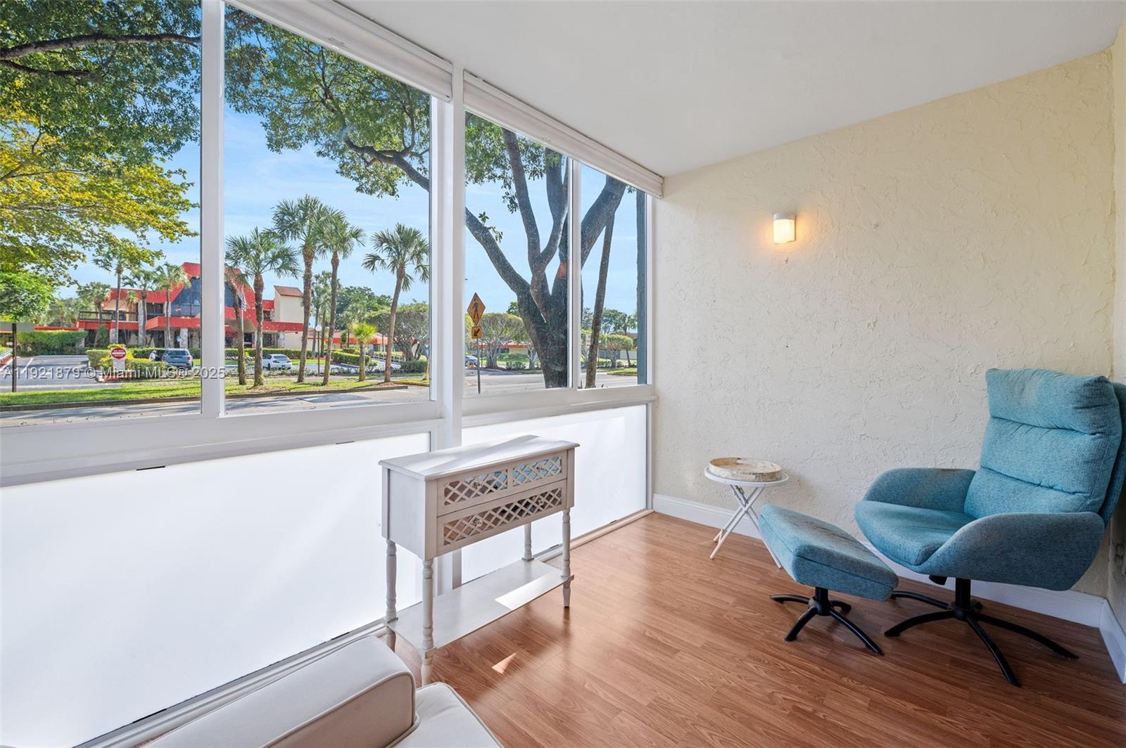 3140 Holiday Springs Boulevard, Unit 9102 Margate, FL 33063 - Photo 13 of 35 a living room with furniture and a window