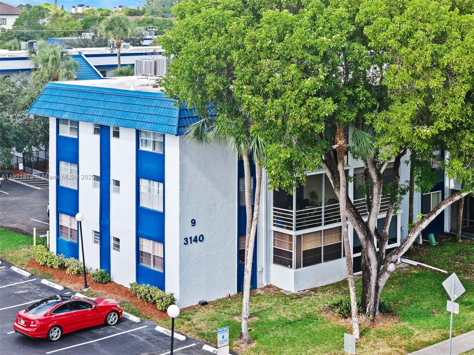 3140 Holiday Springs Boulevard, Unit 9102 Margate, FL 33063 - Photo 6 of 35 a house view with a backyard space