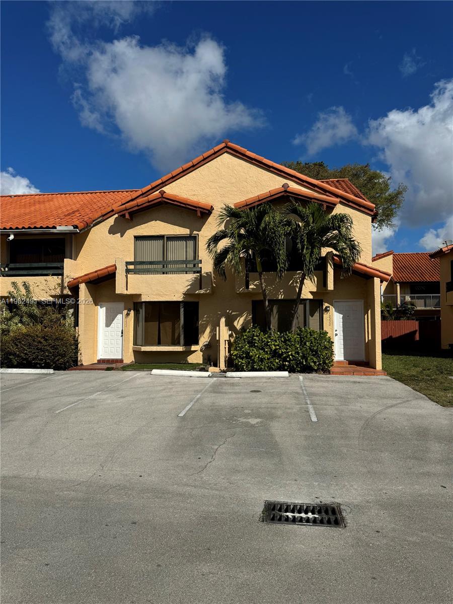 10220 Southwest 77th Court Miami, FL 33156 - Photo 1 of 12 a front view of house with yard