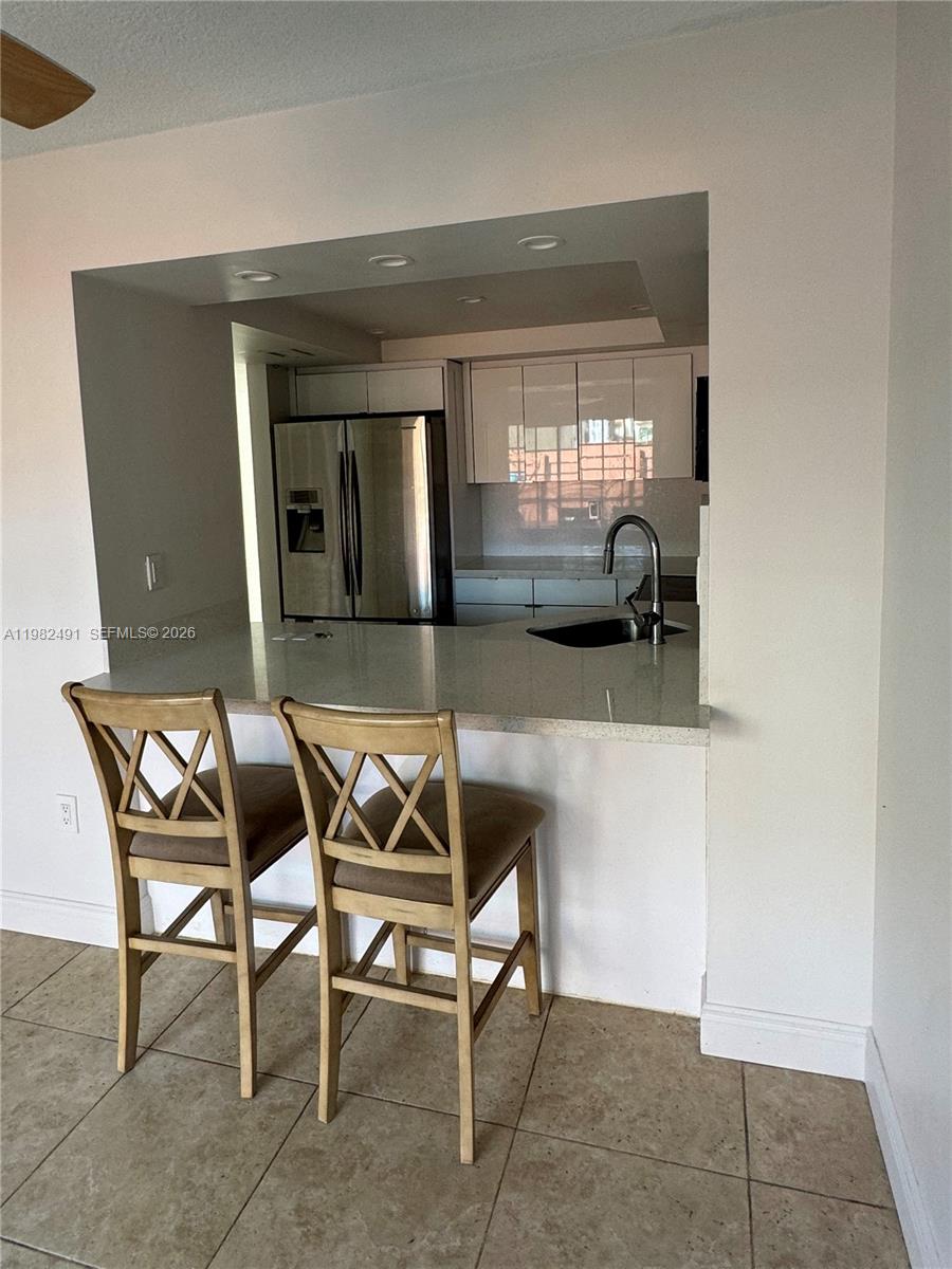 10220 Southwest 77th Court Miami, FL 33156 - Photo 6 of 12 a view of a livingroom with furniture and window