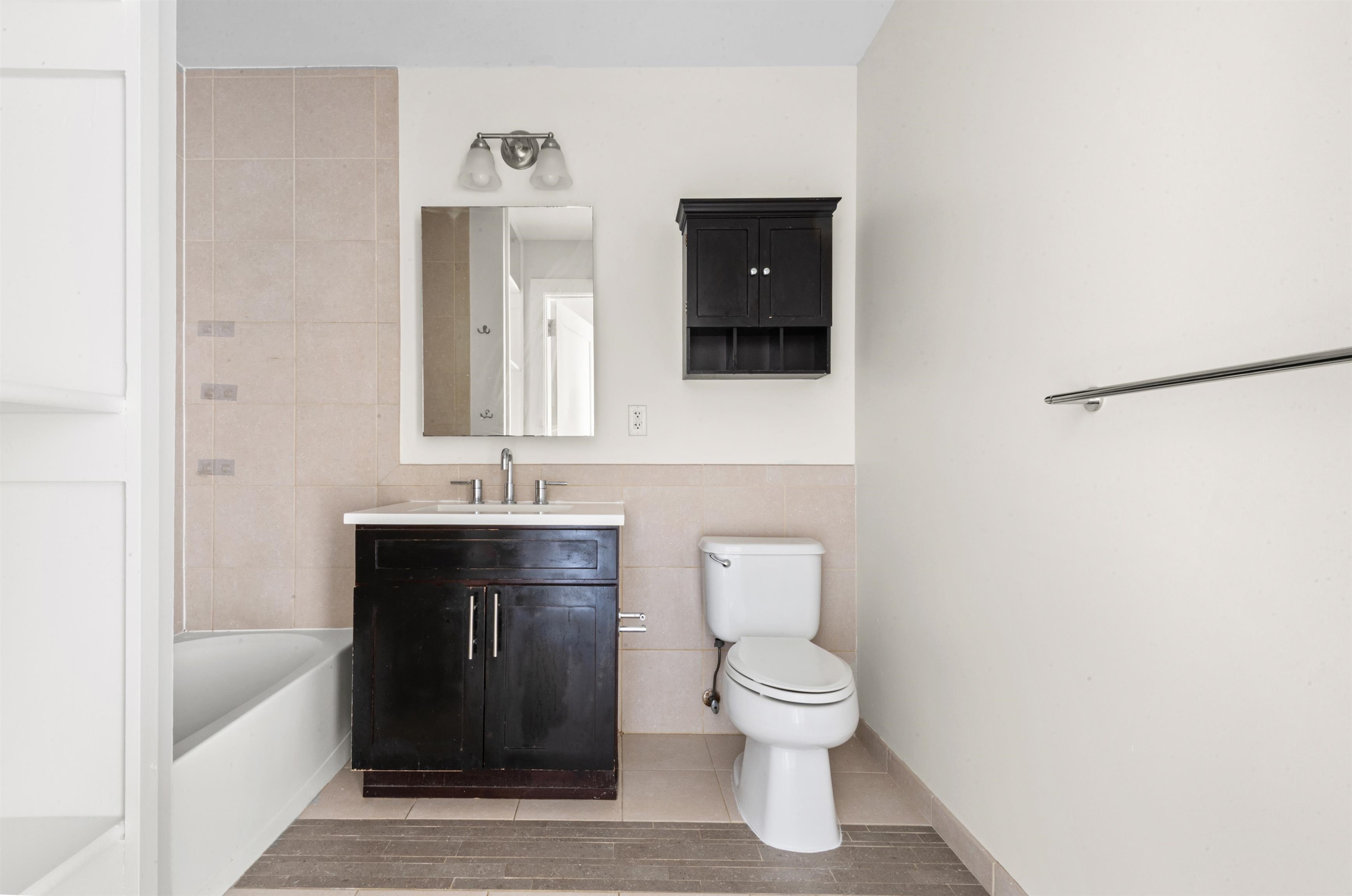 3312 Hudson Avenue, Unit 12F Union City, NJ 07087 - Photo 16 of 32 a bathroom with a sink and a mirror