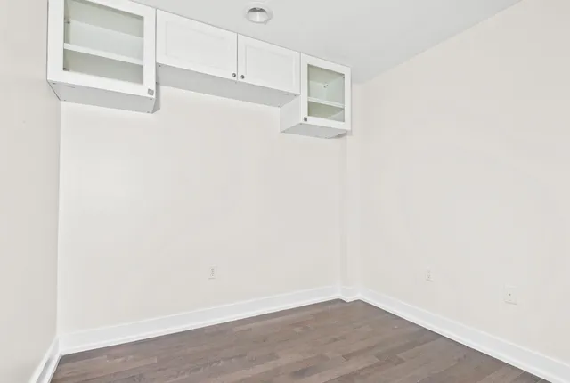 a view of a small space with wooden floor