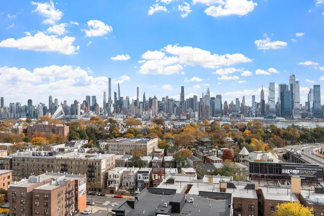 a view of a city with tall buildings