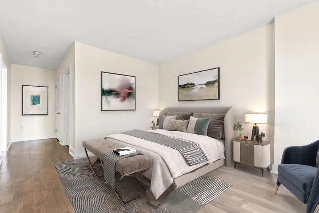 a bedroom with a large bed and a couch