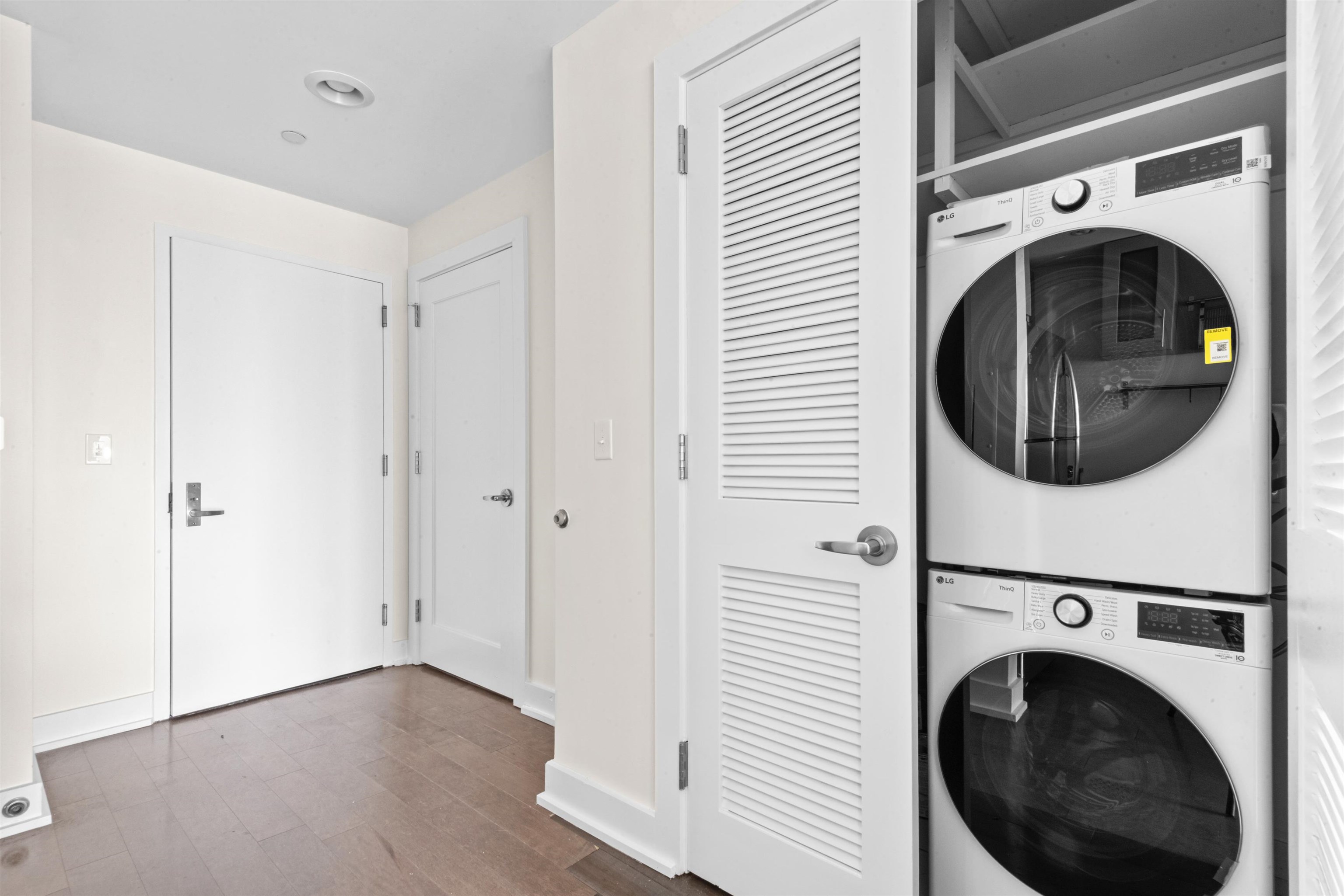 3312 Hudson Avenue, Unit 12F Union City, NJ 07087 - Photo 8 of 32 a view of a hallway with washer and dryer