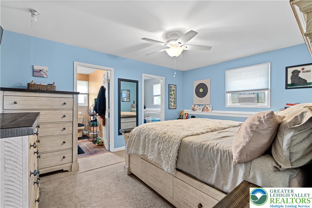50 Kohls Road Northampton, PA 18067 - Photo 30 of 54 Relax in this well-lit bedroom featuring a ceiling fan and convenient access to an adjacent bathroom.