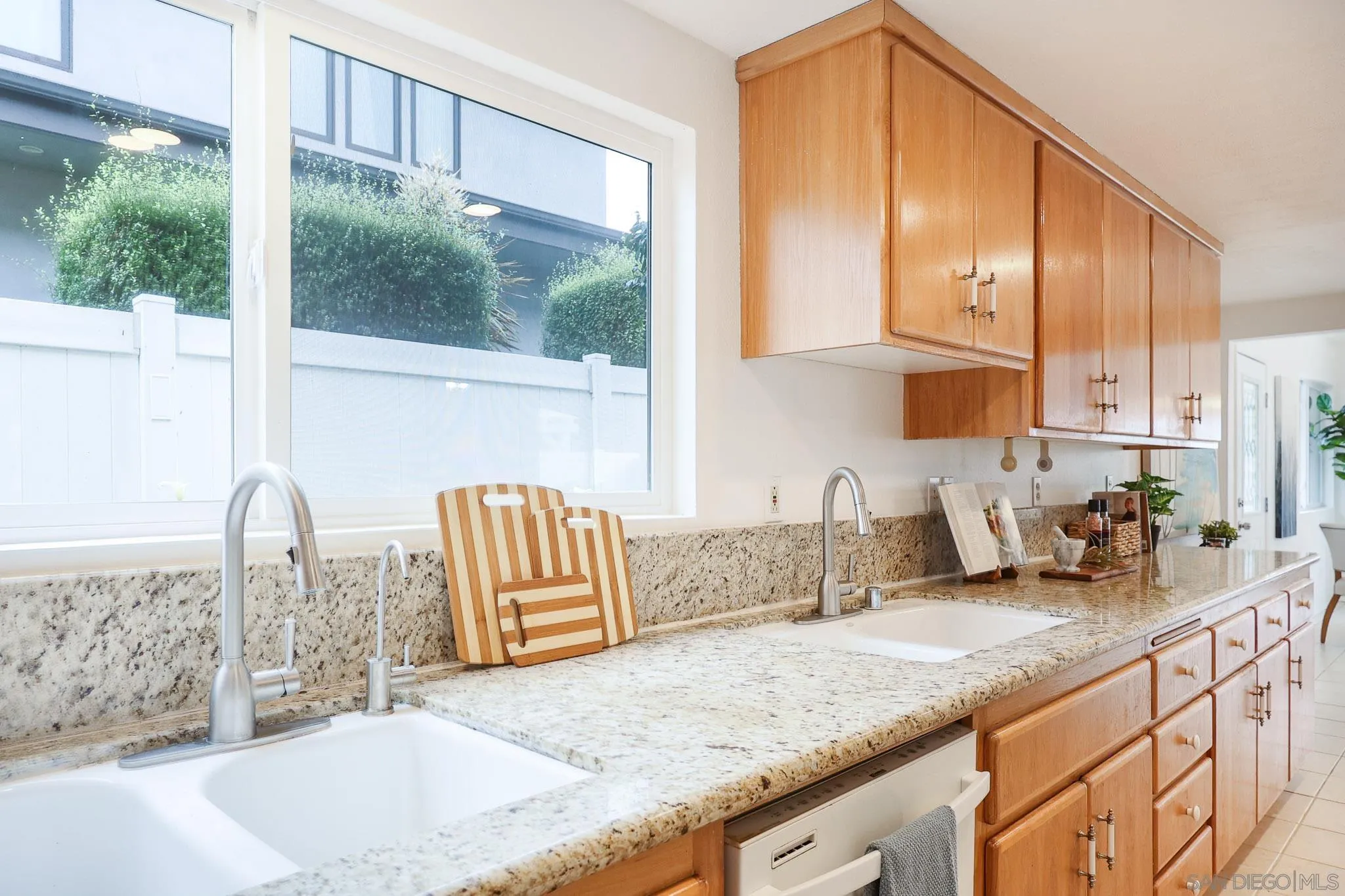 13933 Recuerdo Drive Del Mar, CA 92014 - Photo 15 of 44 a kitchen with granite countertop a sink a counter top space and cabinets