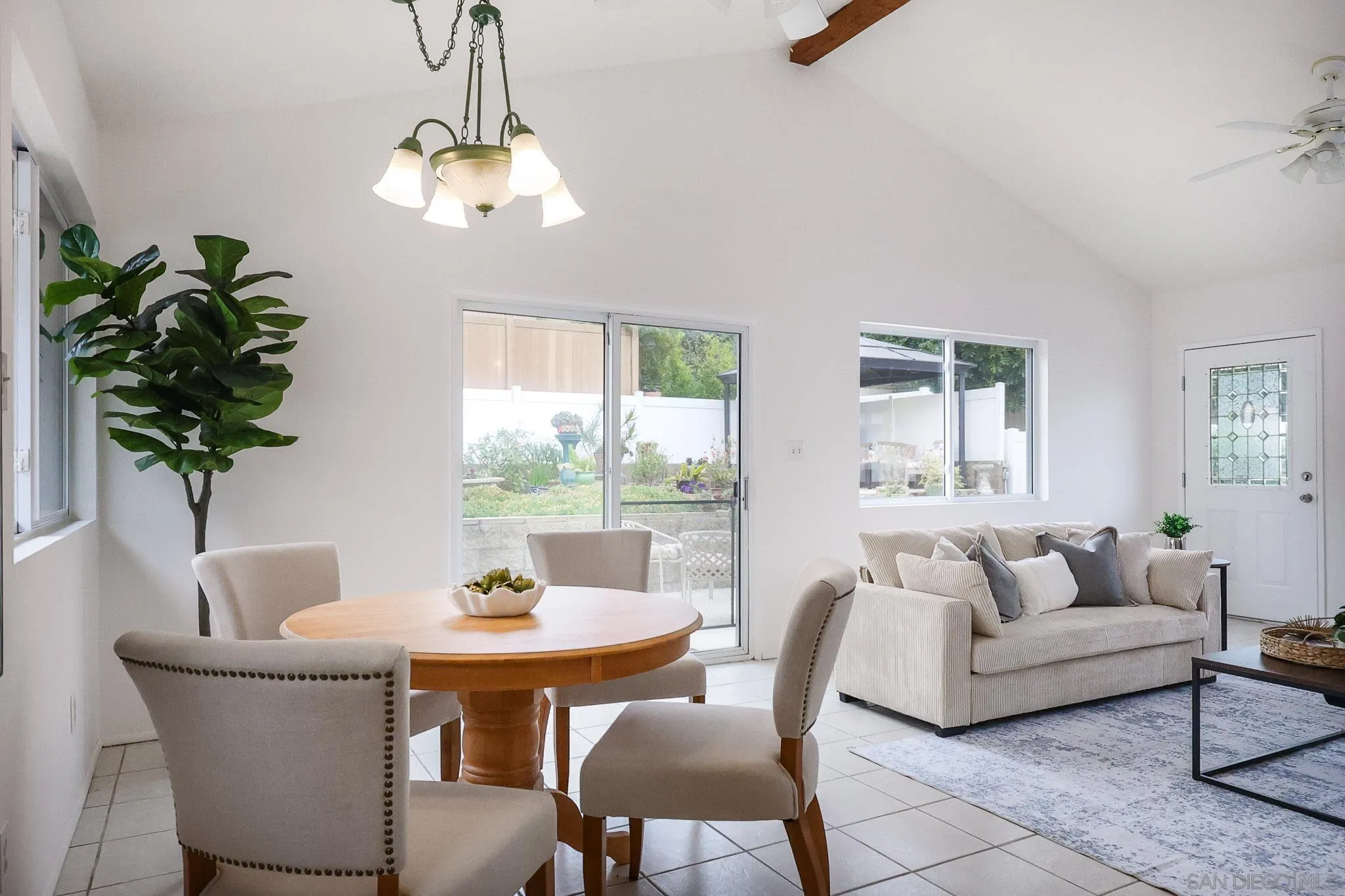 13933 Recuerdo Drive Del Mar, CA 92014 - Photo 17 of 44 a dining room with furniture potted plants and wooden floor
