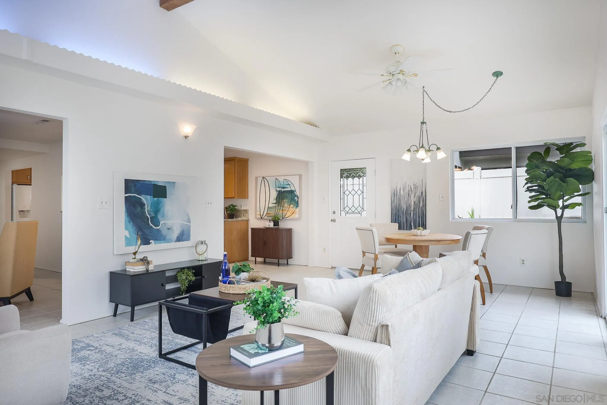 13933 Recuerdo Drive Del Mar, CA 92014 - Photo 18 of 44 a living room with furniture a chandelier and a dining table
