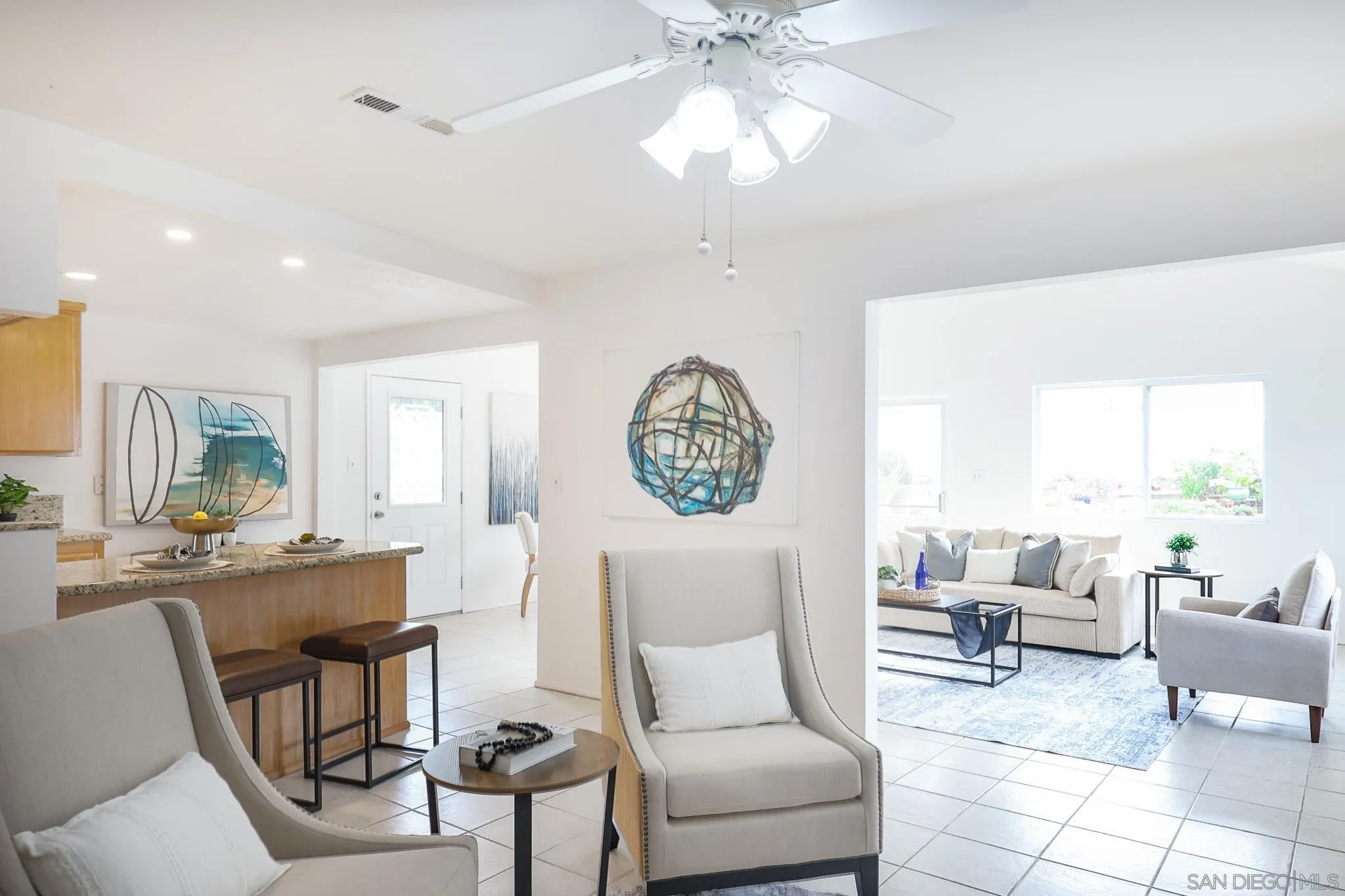 13933 Recuerdo Drive Del Mar, CA 92014 - Photo 19 of 44 a living room with furniture a fireplace and a chandelier