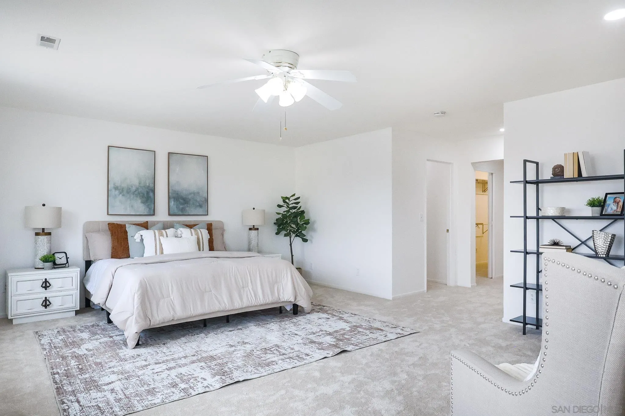 13933 Recuerdo Drive Del Mar, CA 92014 - Photo 25 of 44 a room with a bed and a chandelier