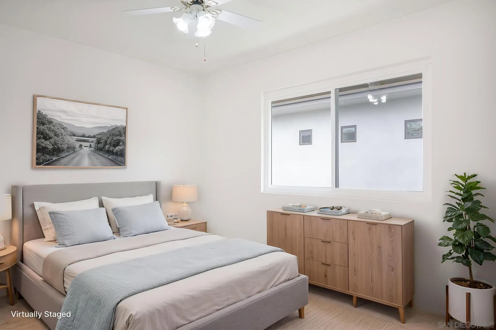 13933 Recuerdo Drive Del Mar, CA 92014 - Photo 29 of 44 a bedroom with a bed and a potted plant