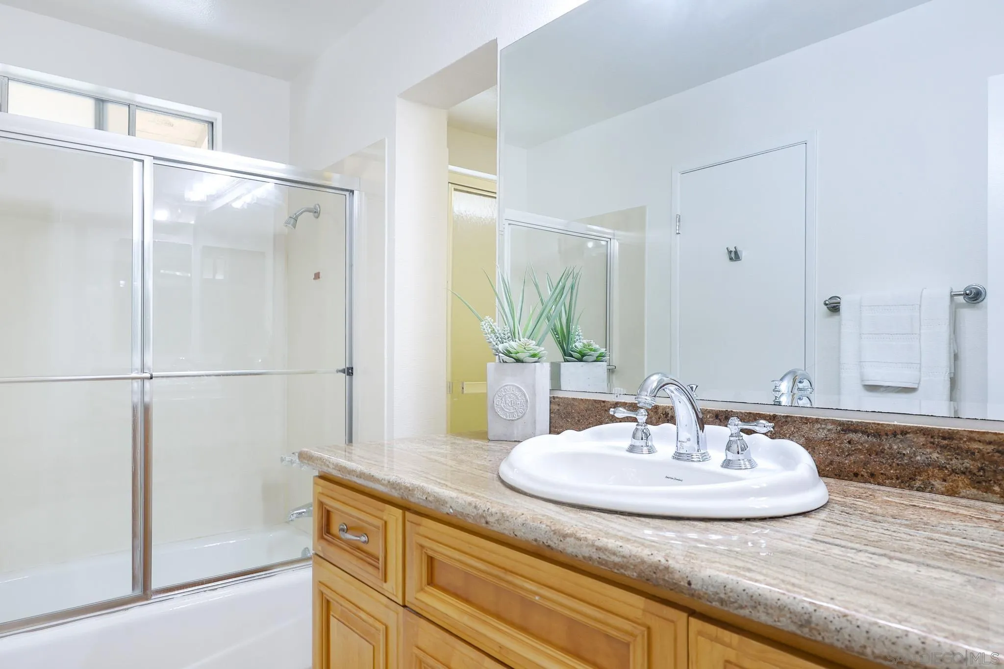 13933 Recuerdo Drive Del Mar, CA 92014 - Photo 35 of 44 a bathroom with a sink and a mirror