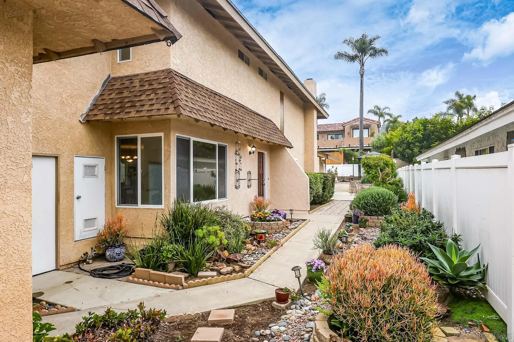 13933 Recuerdo Drive Del Mar, CA 92014 - Photo 4 of 44 a front view of a house with a yard