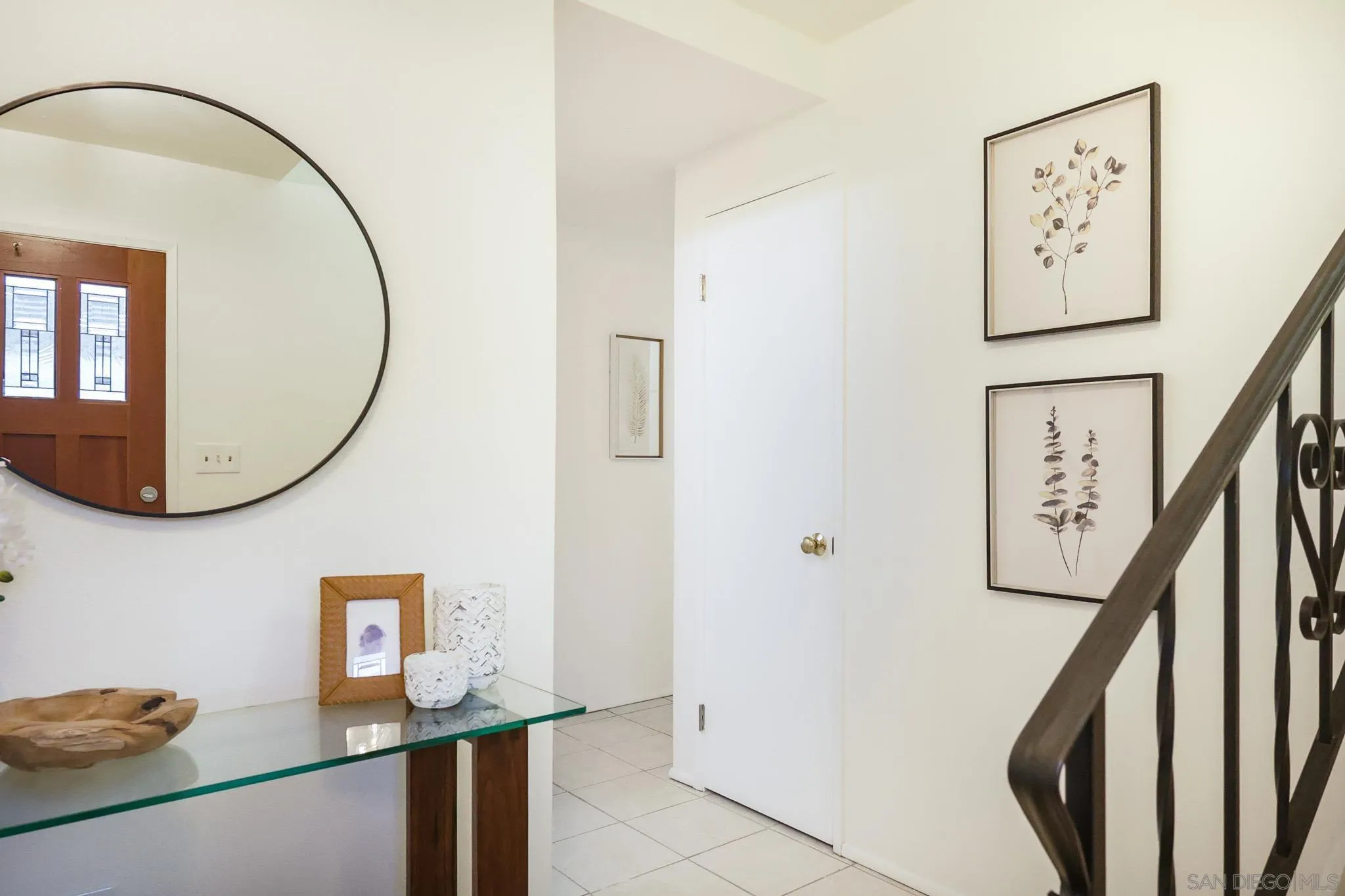 13933 Recuerdo Drive Del Mar, CA 92014 - Photo 5 of 44 a view of a hallway with paintings on the wall