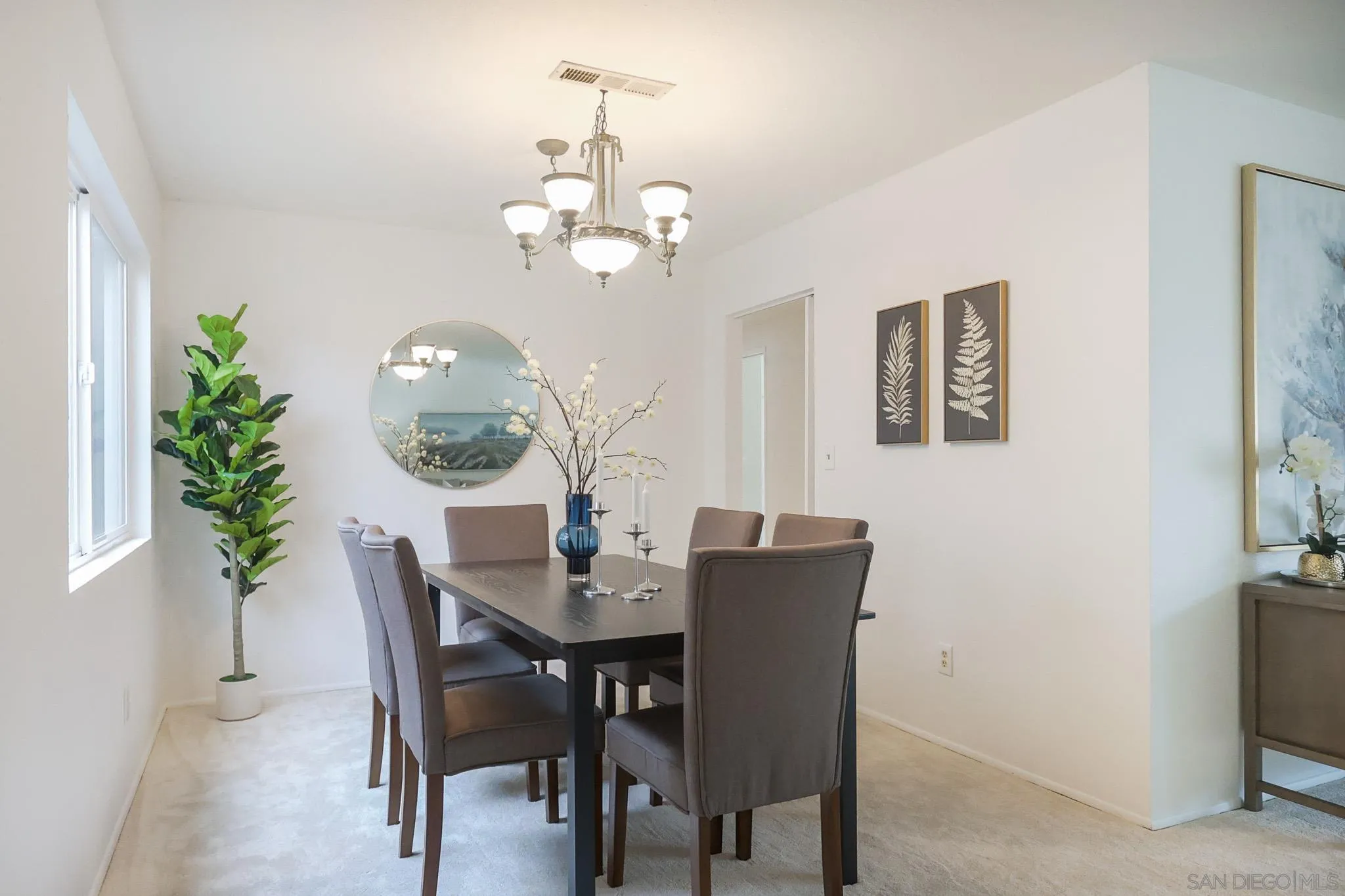 13933 Recuerdo Drive Del Mar, CA 92014 - Photo 10 of 44 a view of a dining room with furniture and chandelier