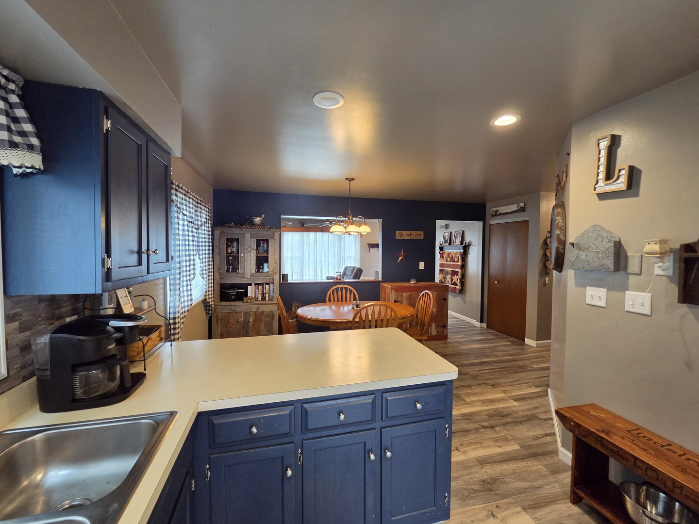 1000 West McKinley Road Ottawa, IL 61350 - Photo 9 of 19 a large kitchen with stainless steel appliances a large counter top a stove and a refrigerator