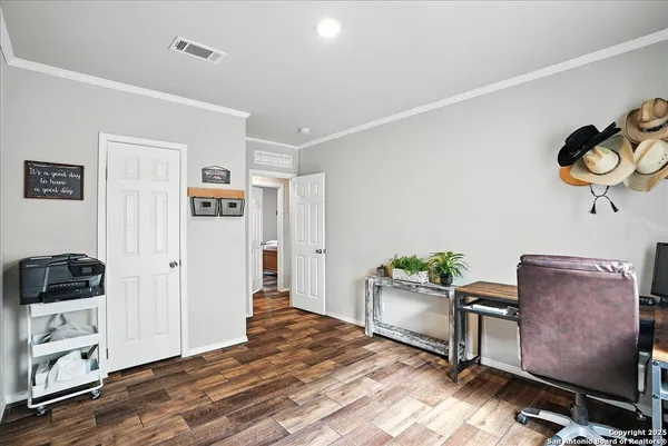 a workspace with furniture and wooden floor