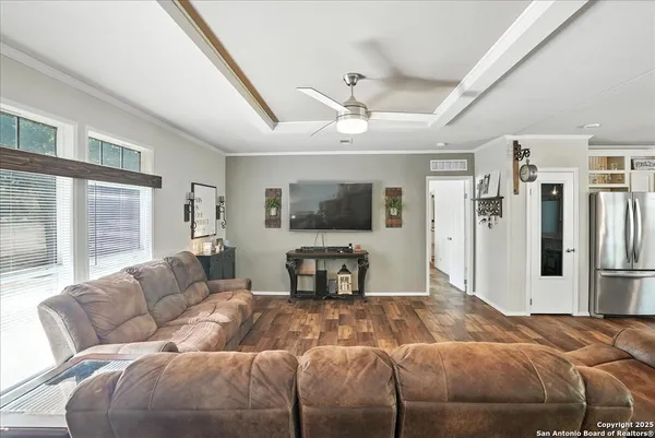 a bedroom with a large bed and a couch