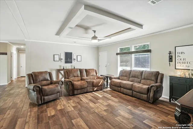 a living room with furniture and a window