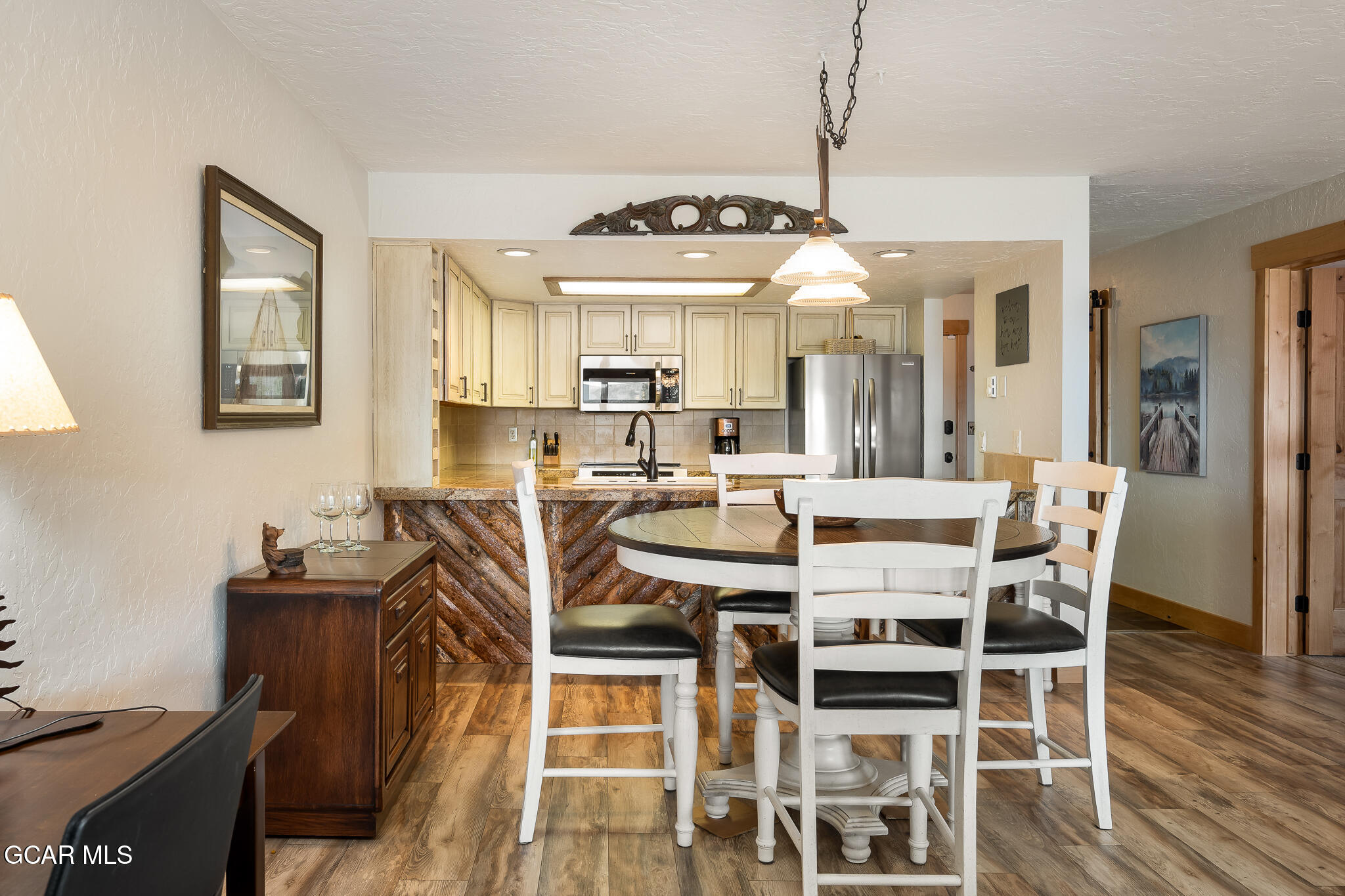 605 Lake Front Road, Unit W8 Grand Lake, CO 80447 - Photo 10 of 28 a view of a dining room with furniture and wooden floor