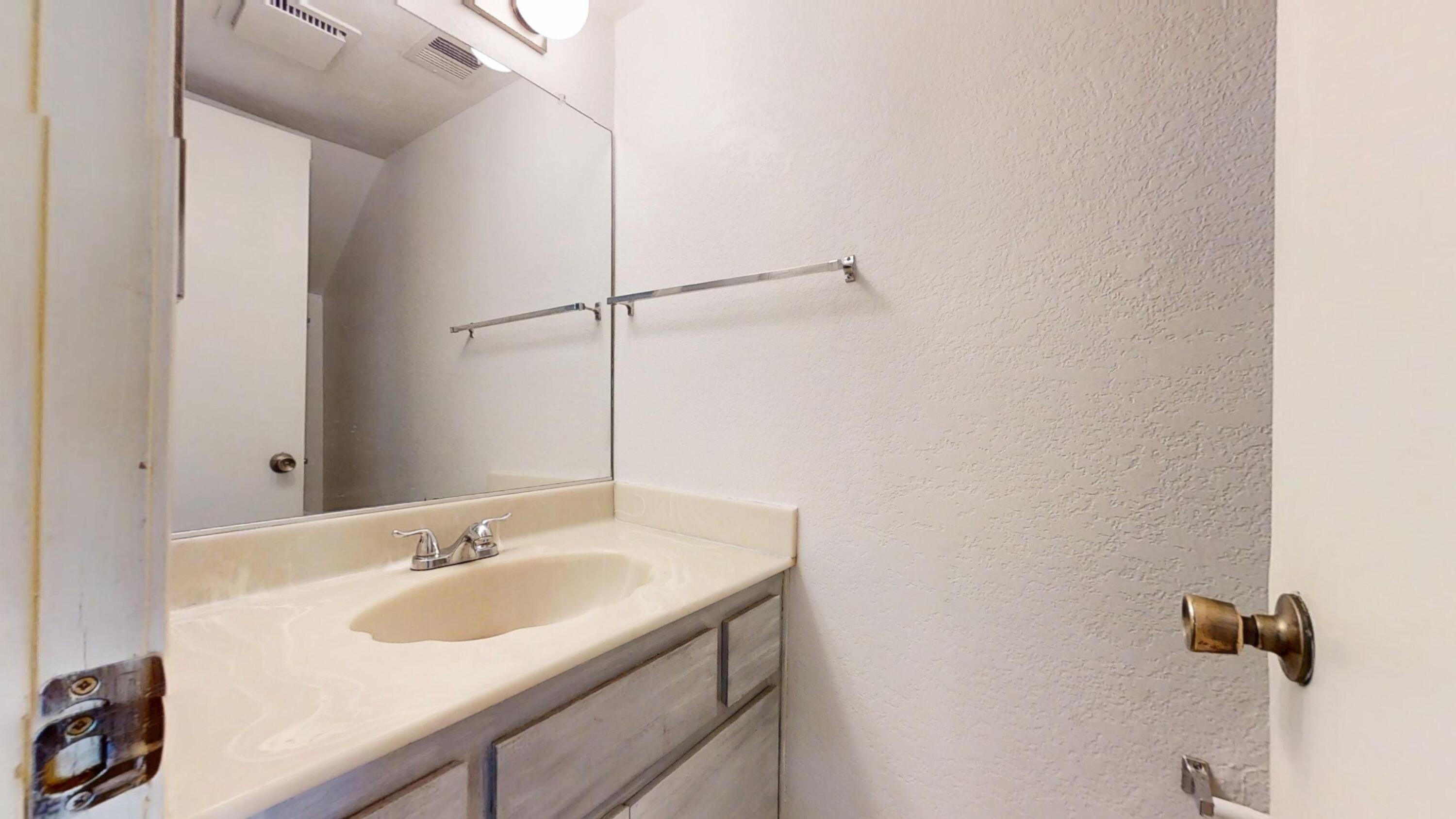 48255 Monroe Street, Unit 2 Indio, CA 92201 - Photo 14 of 35 a bathroom with a sink and a mirror
