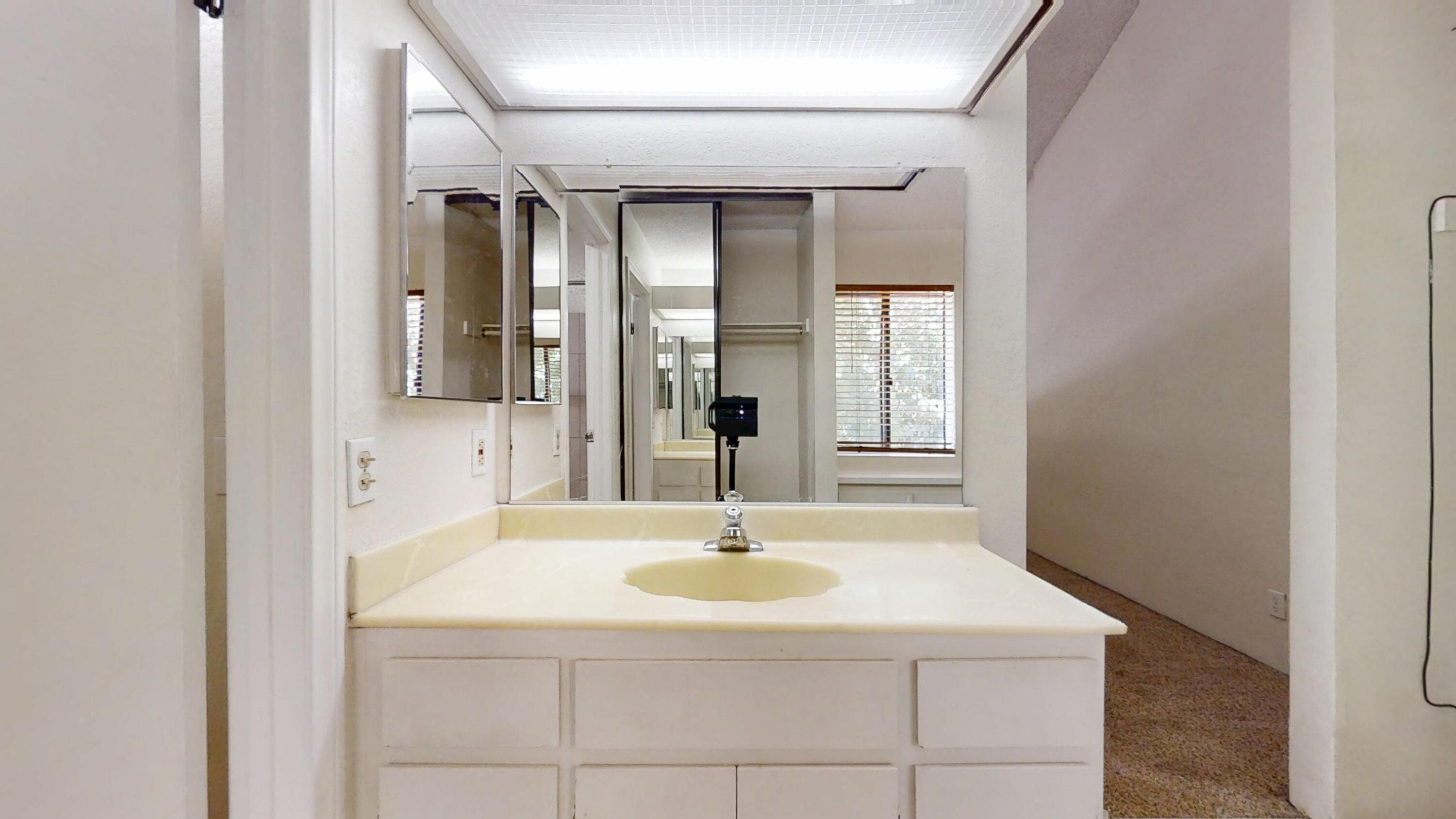 48255 Monroe Street, Unit 2 Indio, CA 92201 - Photo 21 of 35 a bathroom with a sink and a mirror