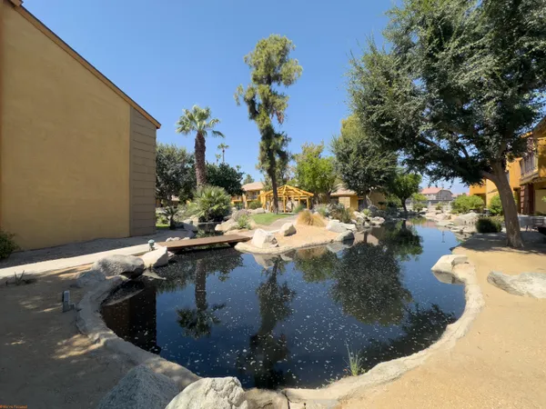 a view of a patio and fire pit