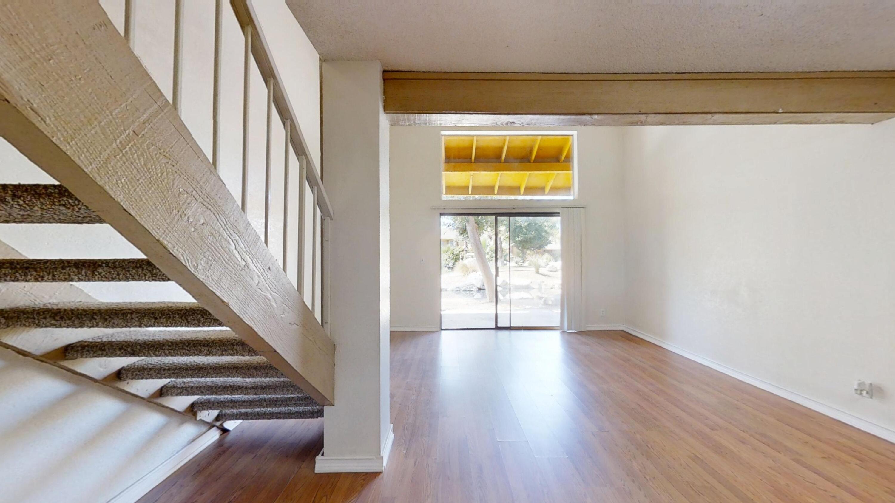 48255 Monroe Street, Unit 2 Indio, CA 92201 - Photo 6 of 35 a view of an entryway with wooden floor and door