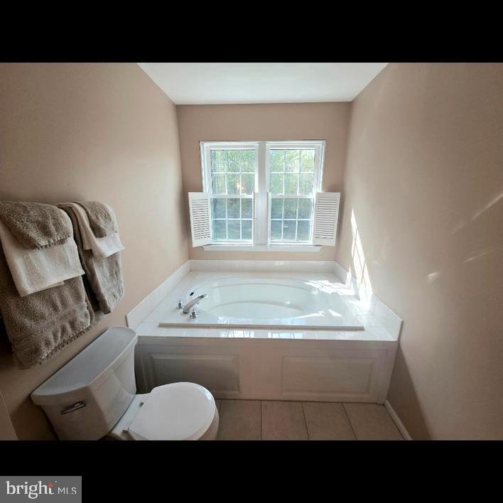 644 Surrey Road Sewell, NJ 08080 - Photo 16 of 37 a bathroom with a sink toilet mirror and tub