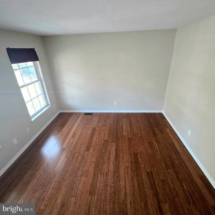 644 Surrey Road Sewell, NJ 08080 - Photo 20 of 37 an empty room with wooden floor and windows