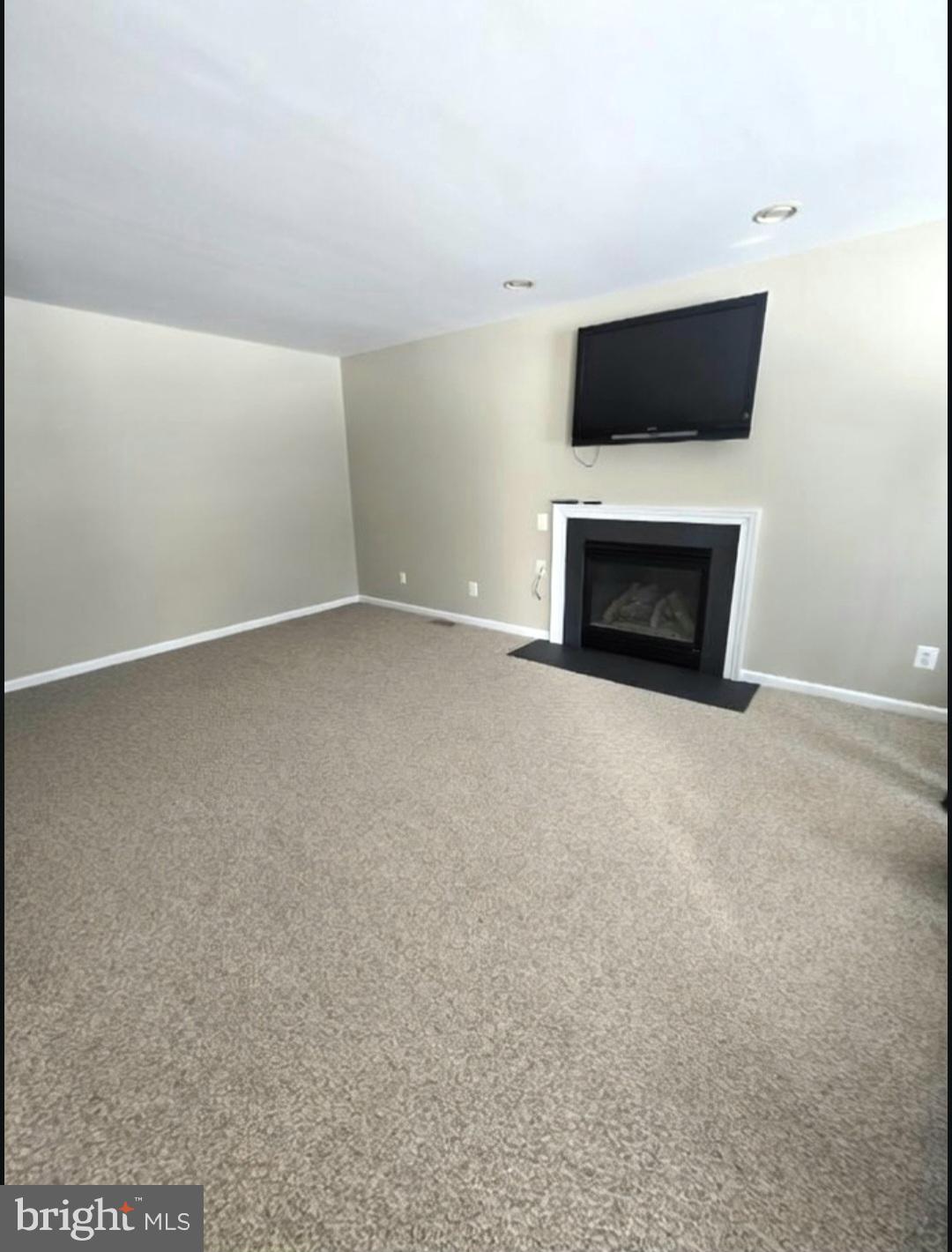 644 Surrey Road Sewell, NJ 08080 - Photo 6 of 37 a view of an empty room with a fireplace