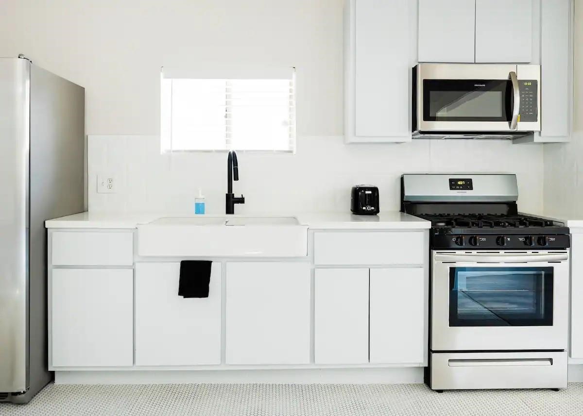 114 Redan Street Houston, TX 77009 - Photo 7 of 14 ull kitchen with stainless steel appliances.