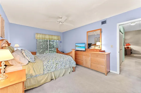 a bedroom with a bed and dresser