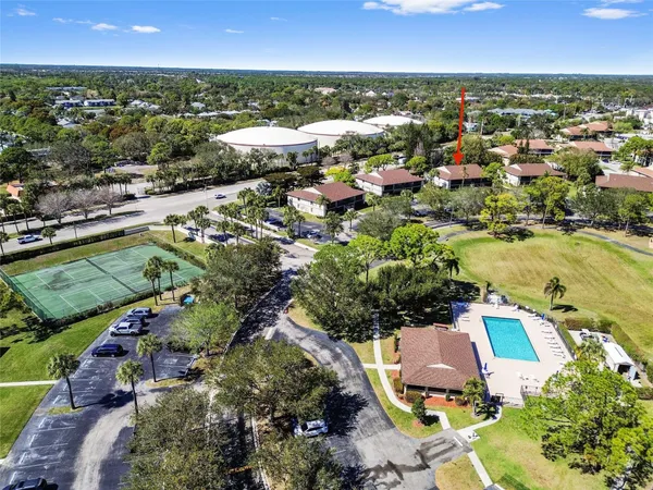 an aerial view of residential houses with outdoor space