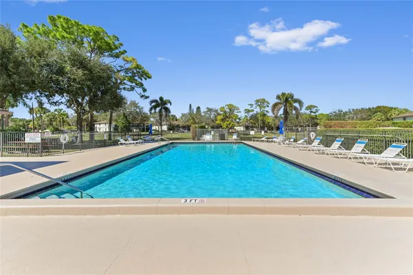 a view of a swimming pool and an outdoor space