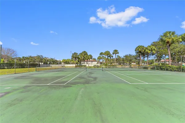 a view of an outdoor space and tennis court
