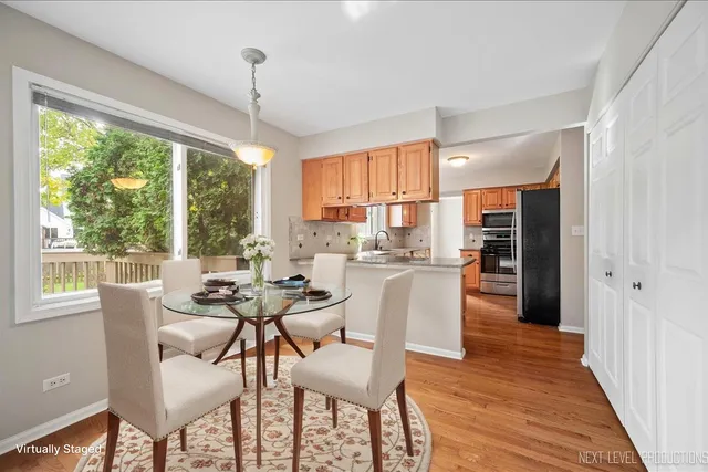 a dining room with furniture and window