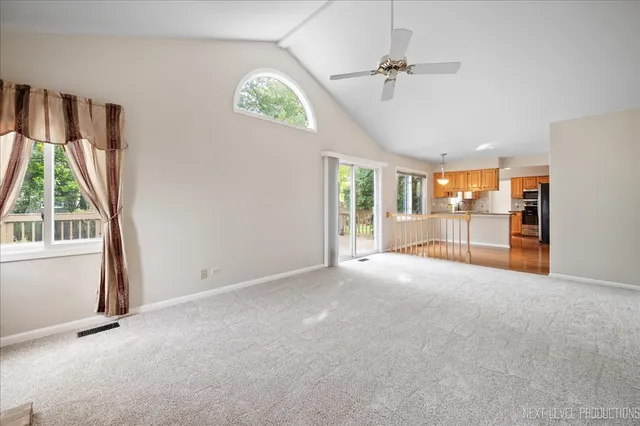 an empty room with windows and outdoor view