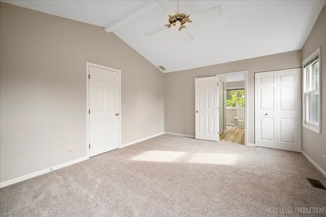 a view of empty room with a fireplace