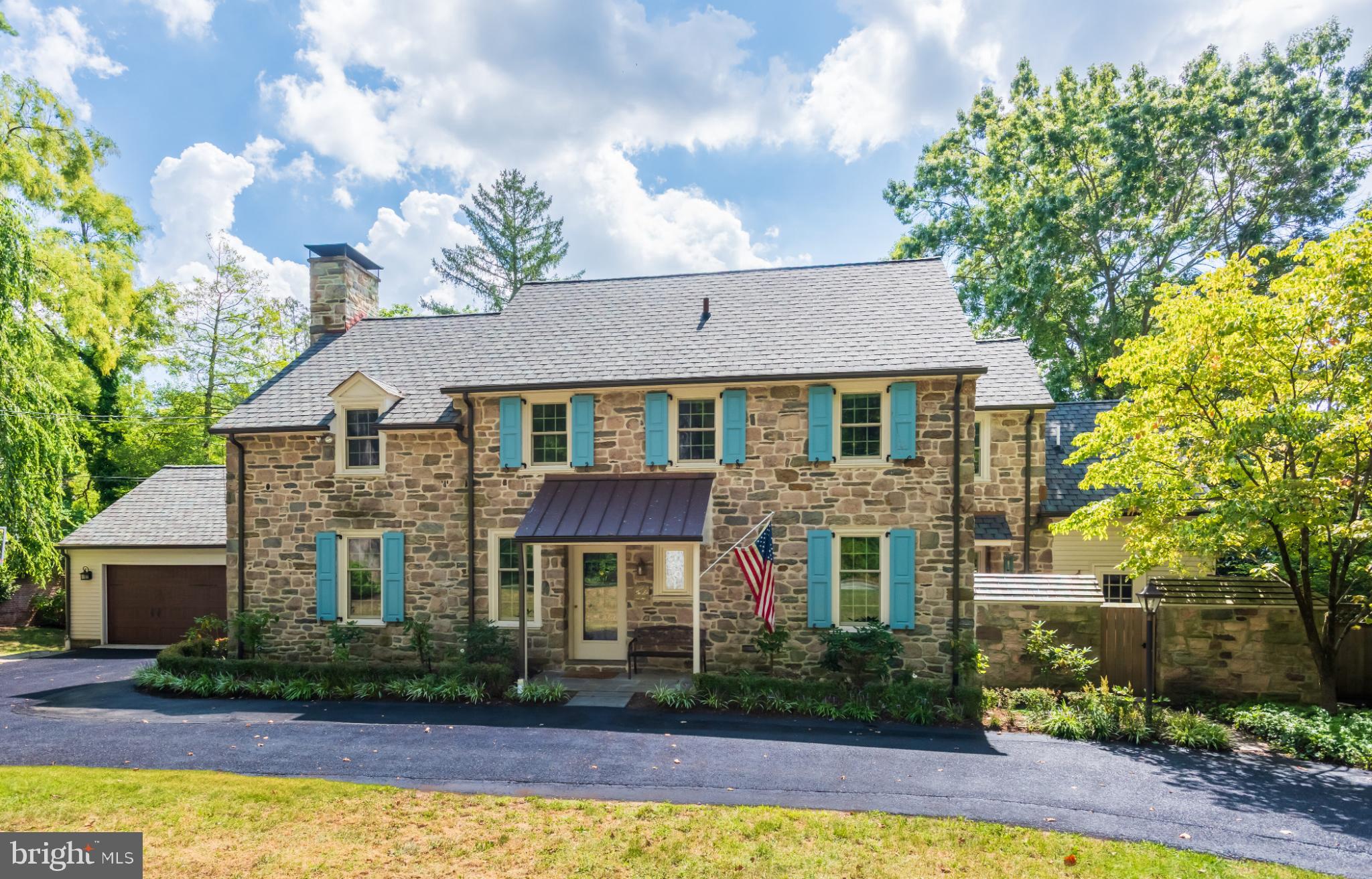 315 Caversham Road Bryn Mawr, PA 19010 - Photo 3 of 55 Charming stone home with vibrant blue shutters.