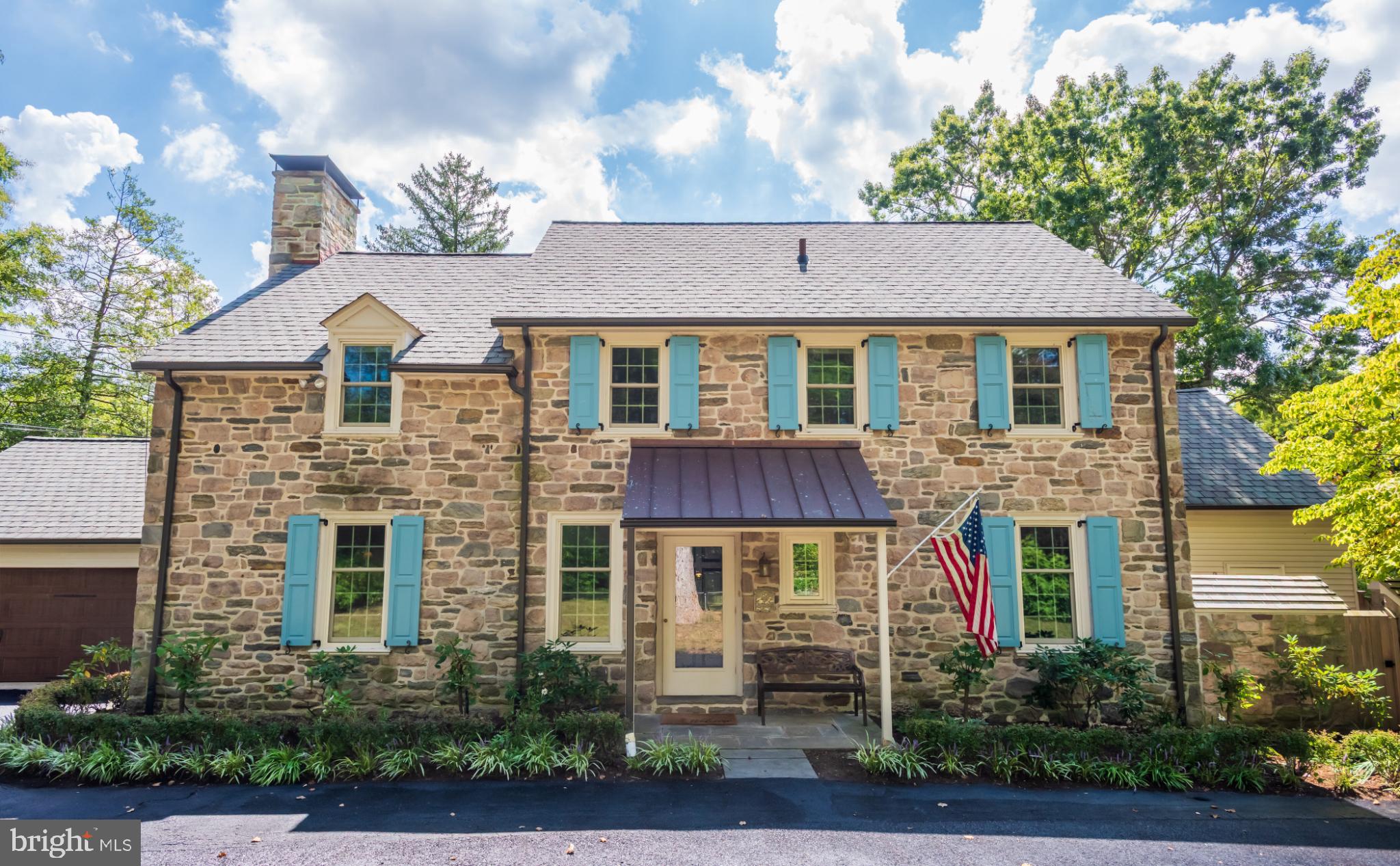 315 Caversham Road Bryn Mawr, PA 19010 - Photo 4 of 55 Charming stone home with vibrant blue shutters.
